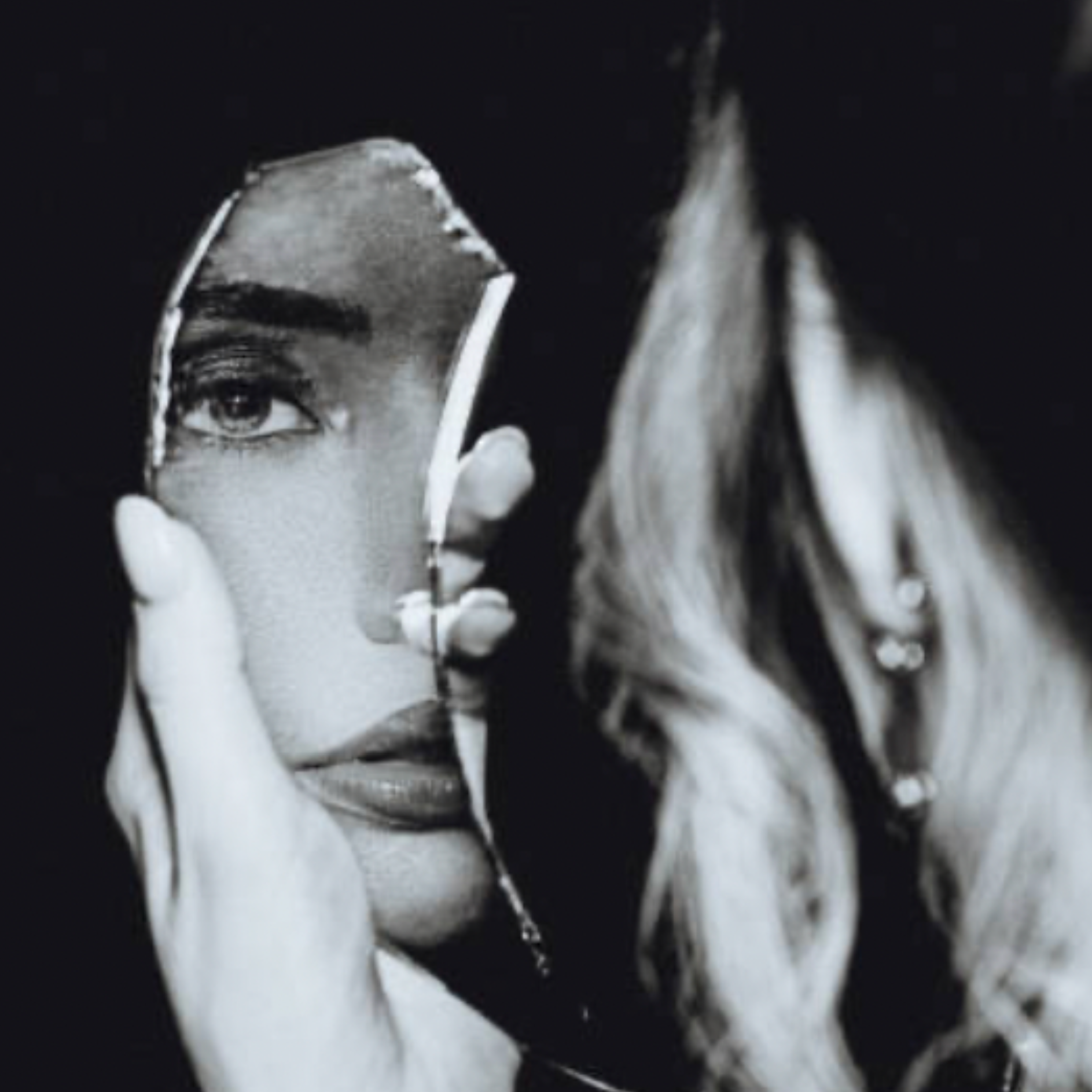 Woman looking into a mirror